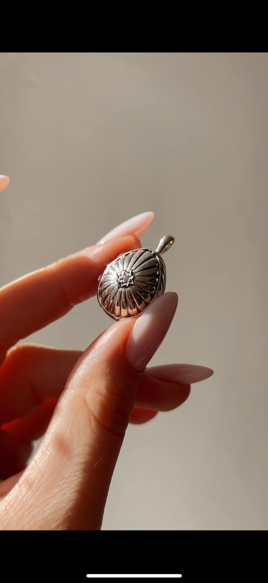 Beautiful silver, diamond and pearl egg pendant. Limited edition by Sarah Faberge