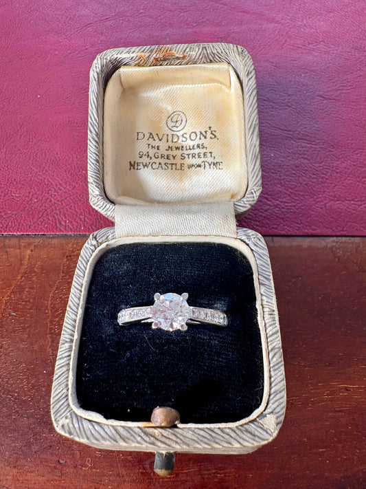 Beautiful Classic Modern Platinum Brilliant-cut Diamond Solitaire Ring with Diamond Shoulders